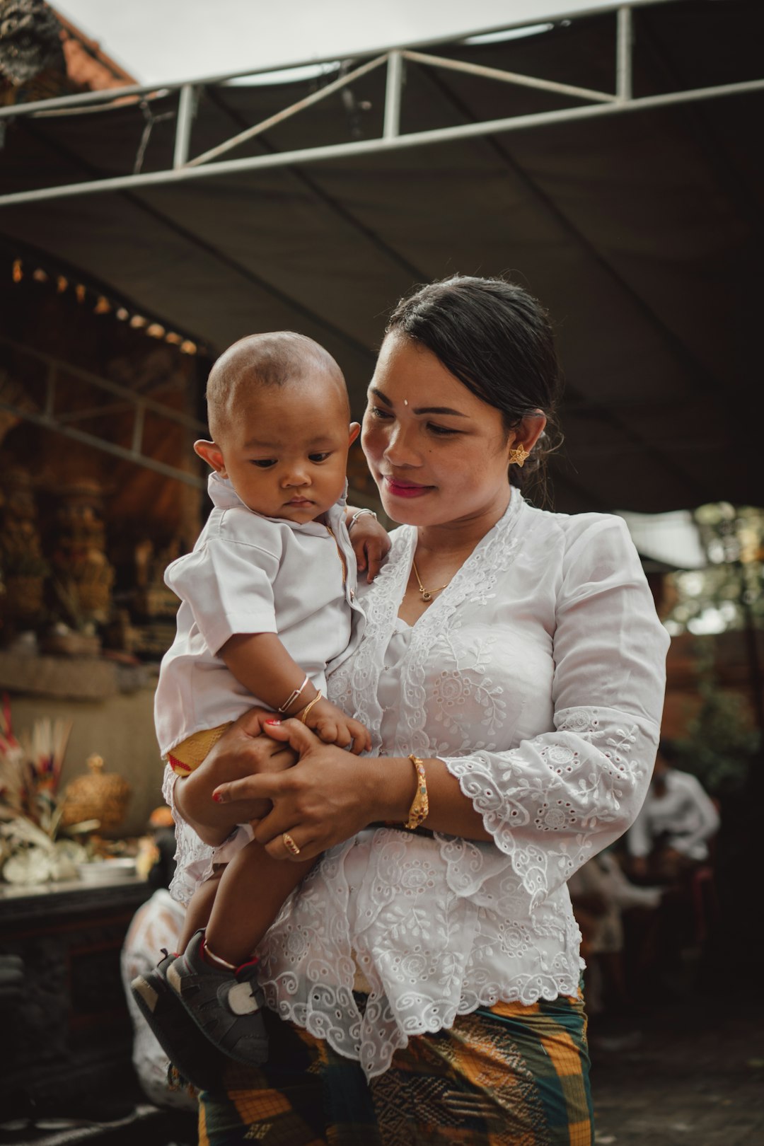 Photo by Polina Kuzovkova a person holding a baby